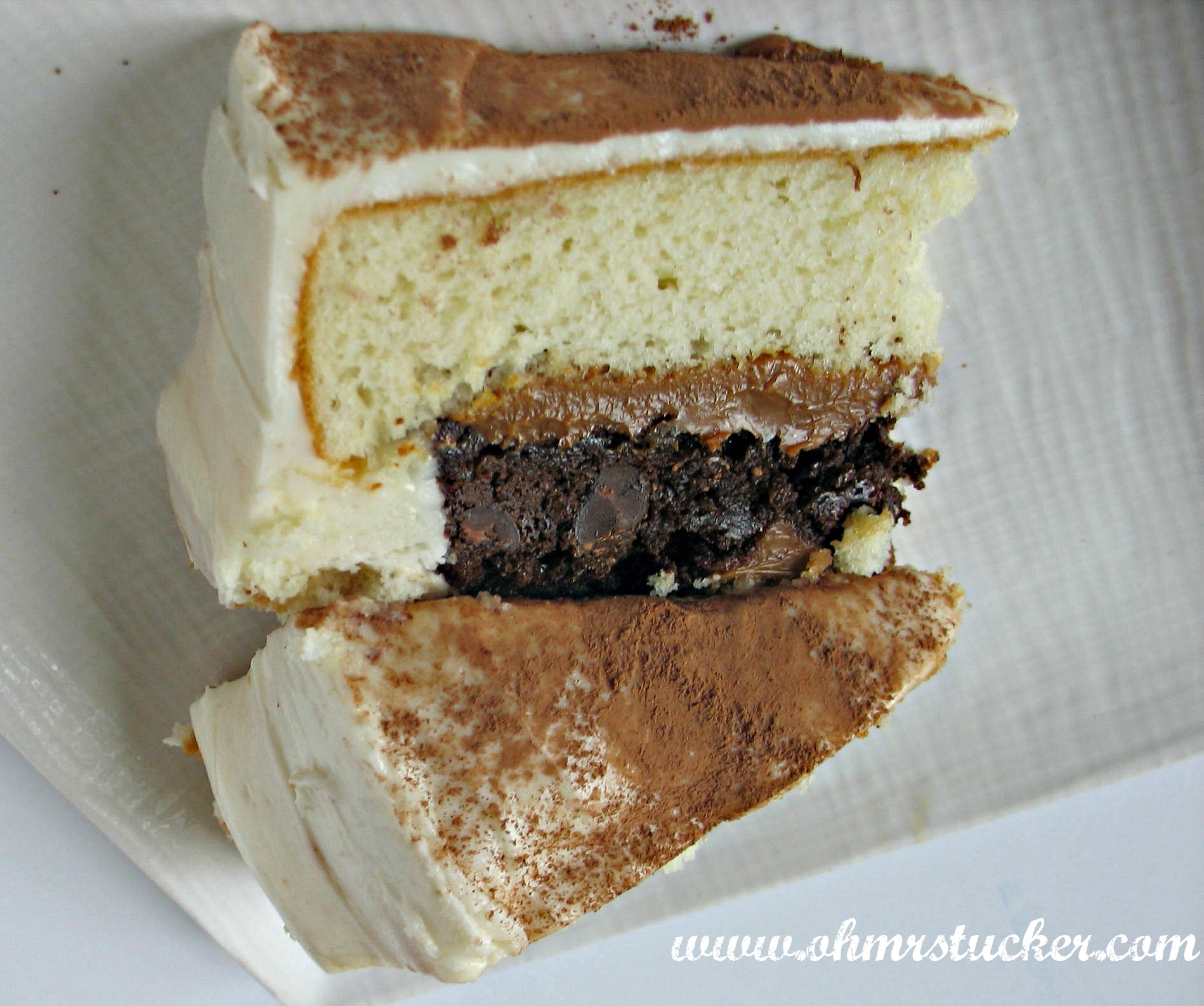 slice of cake with bottom brownie layer