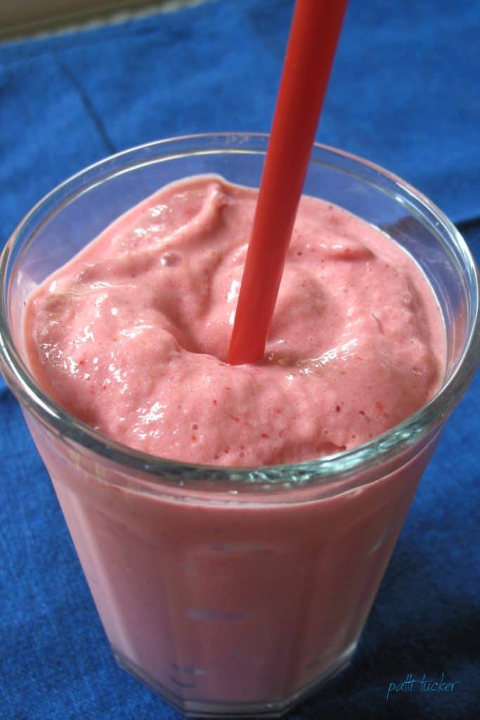 Strawberry Smoothie with red straw
