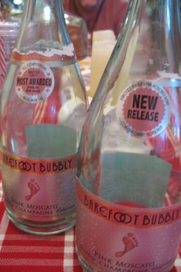 two open bottles of Barefoot Bubbly on a table