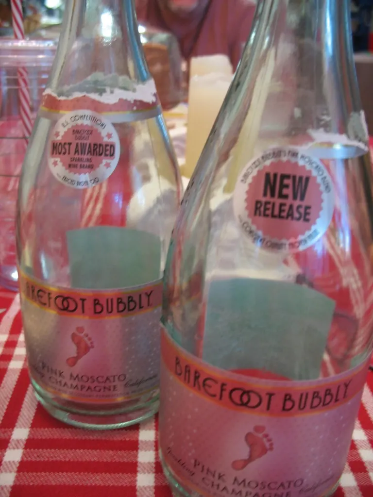 two open bottles of Barefoot Bubbly on a table