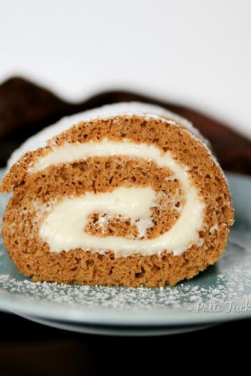 slice of pumpkin roll on blue plate