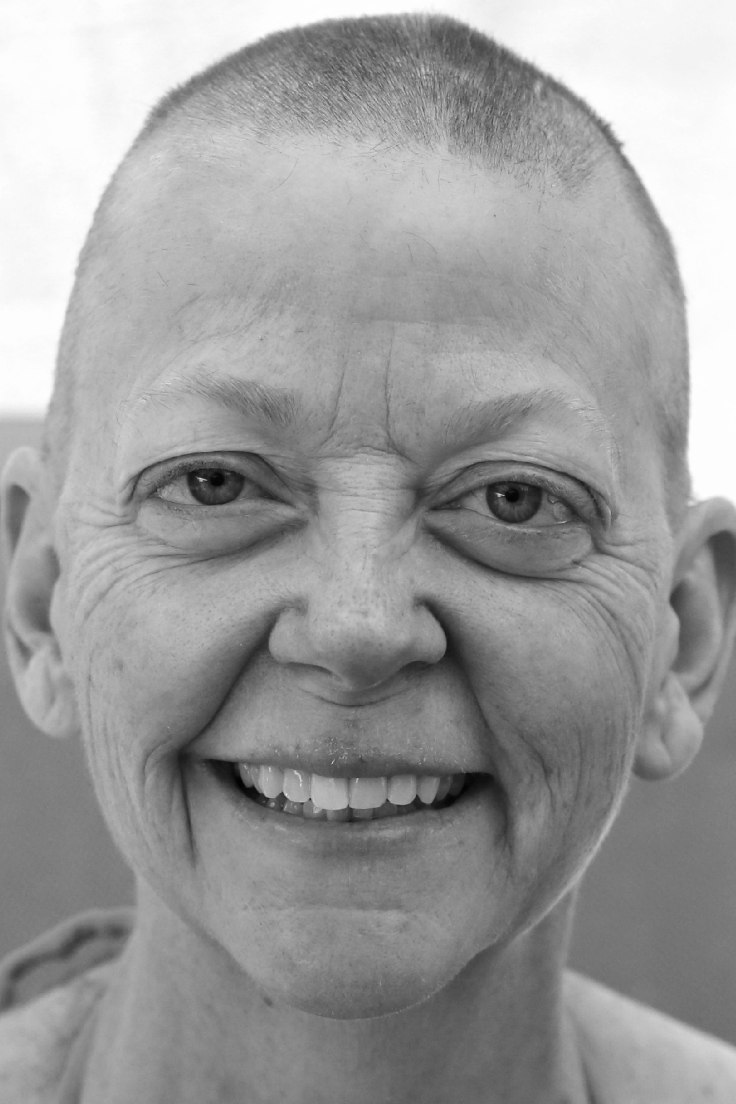 smiling woman with bald head
