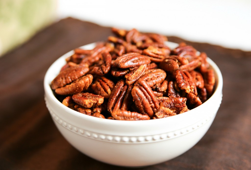 Savory Roasted Pecans in a white bowl on a table