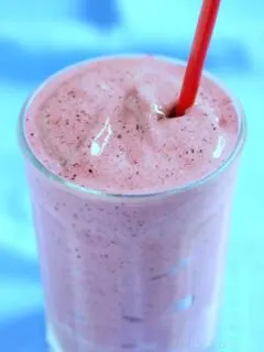 Strawberry Blueberry Smoothie with a red straw