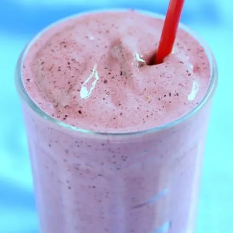 Strawberry Blueberry Smoothie with a red straw