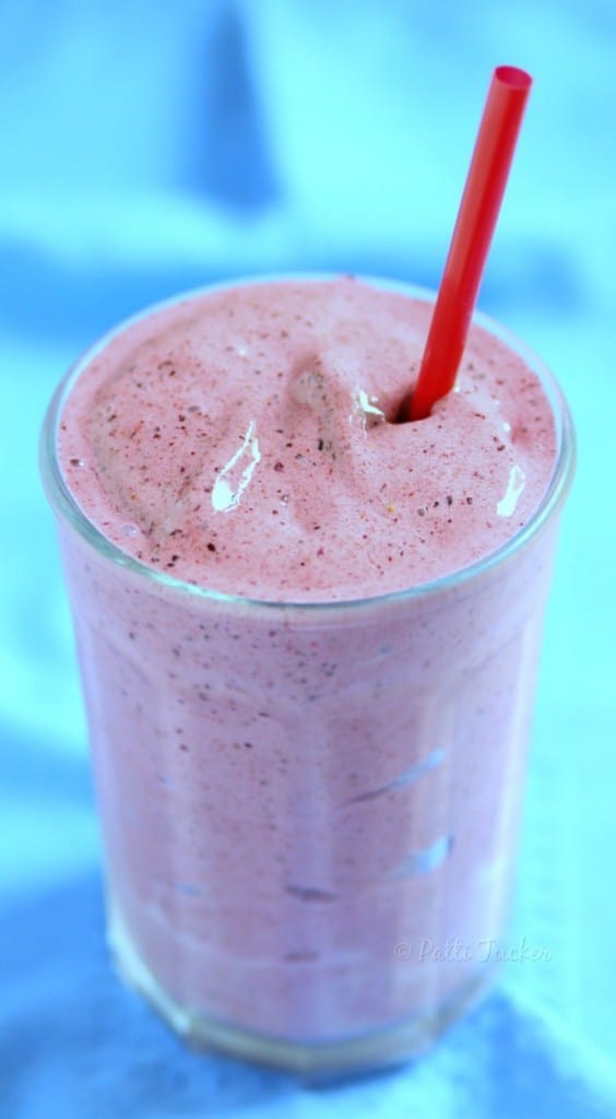 Strawberry Blueberry Smoothie with a red straw