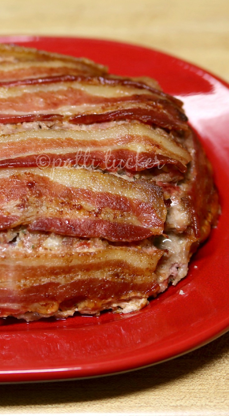 A Bacon Meatloaf on a red platter