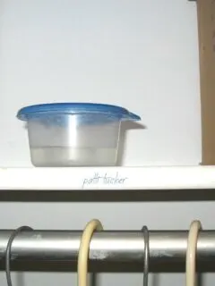 vinegar in a plastic bowl in closet