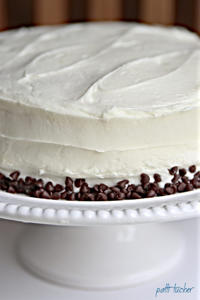 cake with chocolate chip border on a stand