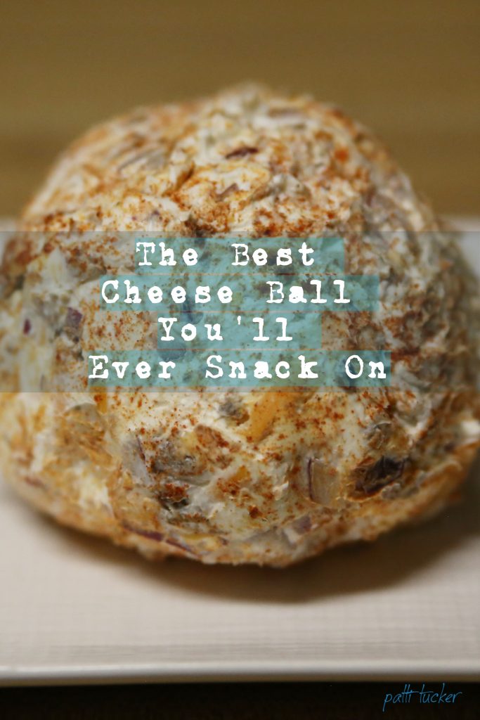 cheeseball on plate with overlay of text