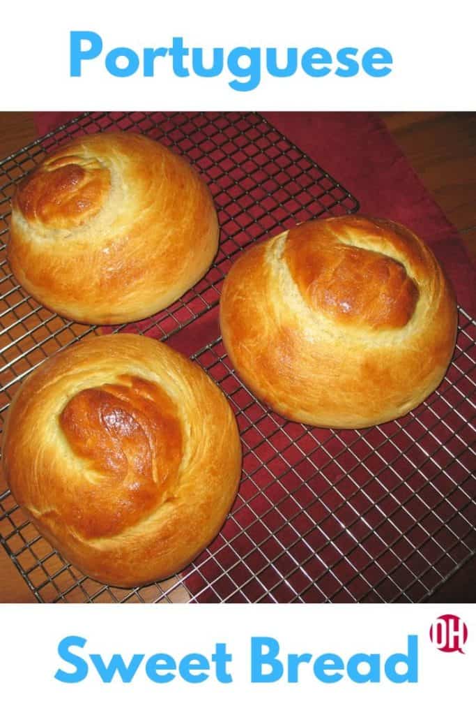 Three loaves of Portuguese Sweet Bread cooling on a wire rack