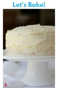 a 1-2-3-4 cake on a white cake pedestal