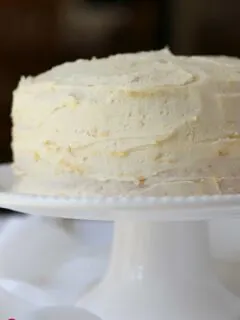 white frosted cake on cake pedestal