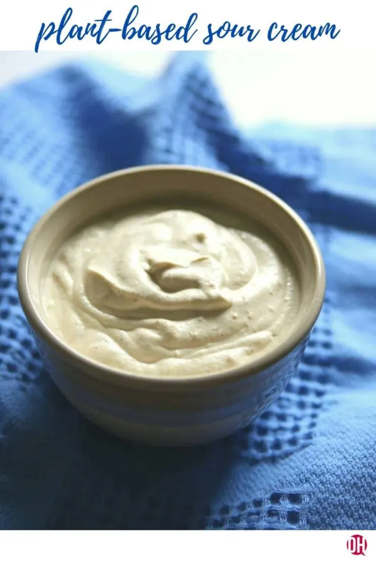 plant-based sour cream in bowl on blue cloth