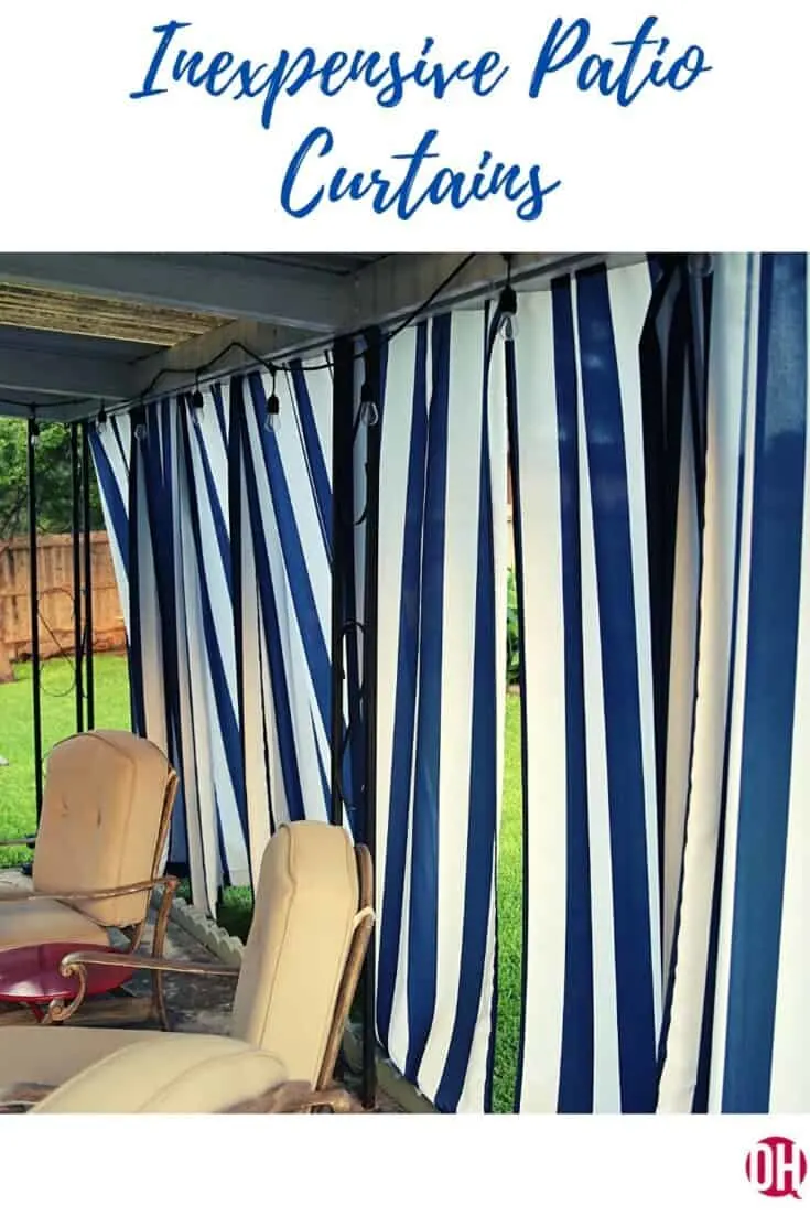 Stripped patio curtain behind patio furniture