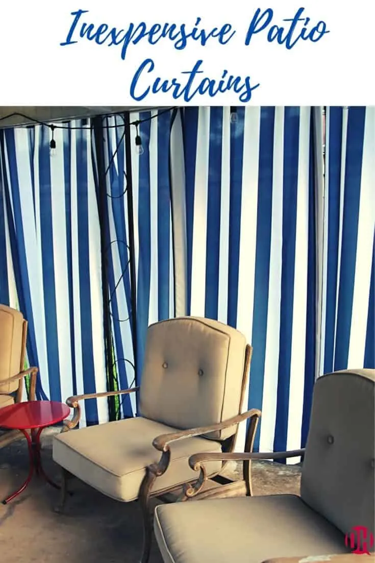 Blue striped patio curtains behind patio chairs.
