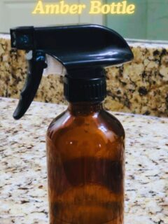 amber glass bottle on counter with text