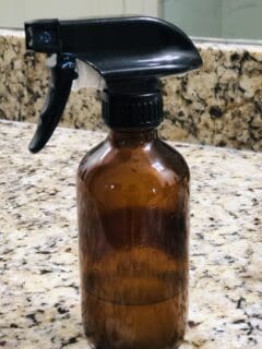 Amber spray bottle on granite counter